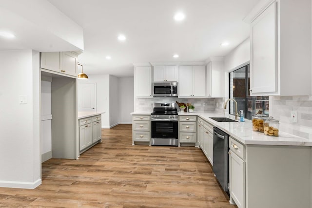 4028 Buckwheat St, Fort Worth, TX 76137 - kitchen featuring stainless steel appliances, a sink, decorative backsplash, baseboards, and recessed lighting
