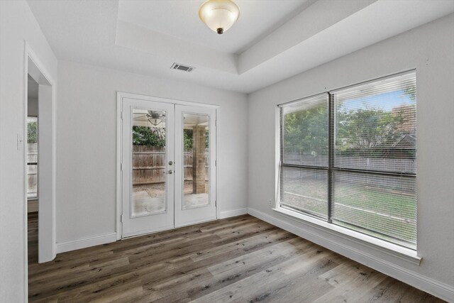 7616 Teresa Ct, North Richland Hills, TX 76182 - empty room with plenty of natural light, wood finished floors, and baseboards