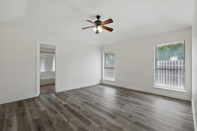 7616 Teresa Ct, North Richland Hills, TX 76182 - spare room with a ceiling fan, wood finished floors, and baseboards