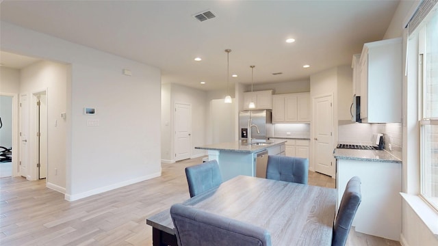 15941 Bronte Ln, Fort Worth, TX 76247 - dining room featuring recessed lighting, light wood-type flooring, and baseboards