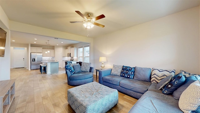15941 Bronte Ln, Fort Worth, TX 76247 - living area featuring light wood-style flooring, ceiling fan, and recessed lighting