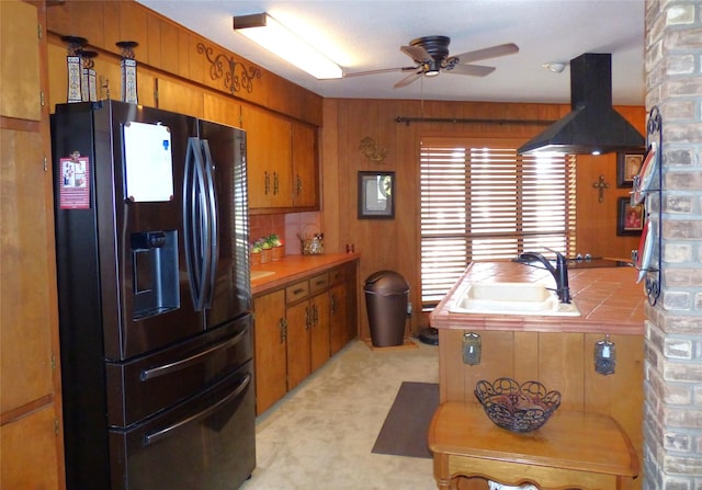 135 Lakeview, Brady, TX 76825 - kitchen with fridge with ice dispenser, tile counters, a sink, ceiling fan, and brown cabinets