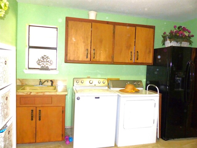 135 Lakeview, Brady, TX 76825 - laundry area with washing machine and clothes dryer and cabinet space
