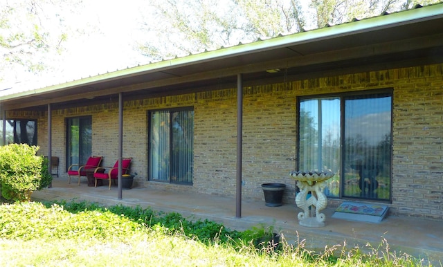 135 Lakeview, Brady, TX 76825 - back of property with brick siding and a porch