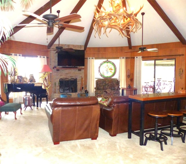 135 Lakeview, Brady, TX 76825 - living room with ceiling fan, beam ceiling, a fireplace, healthy amount of natural light, and a chandelier