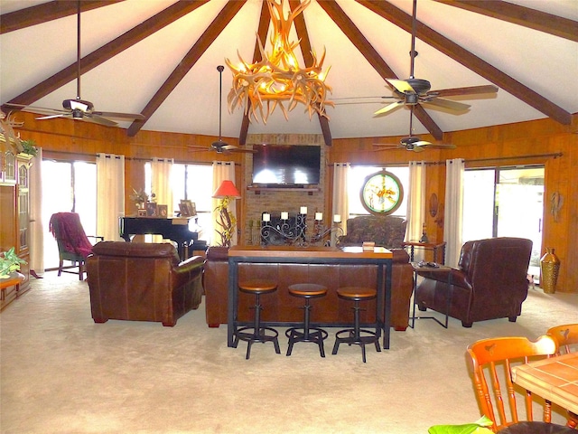 135 Lakeview, Brady, TX 76825 - living area with carpet, a ceiling fan, and wood walls