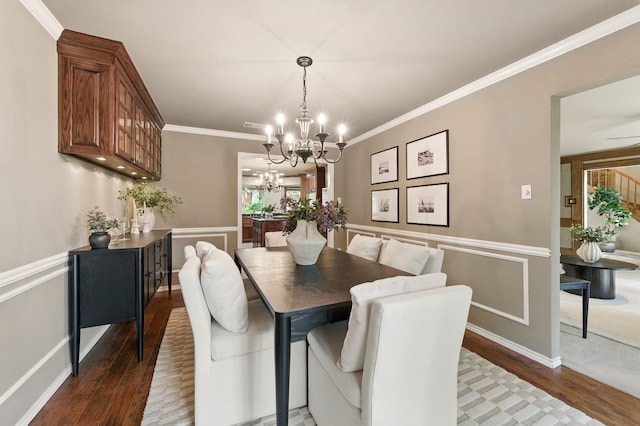 1610 Ottinger Rd, Keller, TX 76262 - dining space featuring wood finished floors, a chandelier, crown molding, and a wainscoted wall