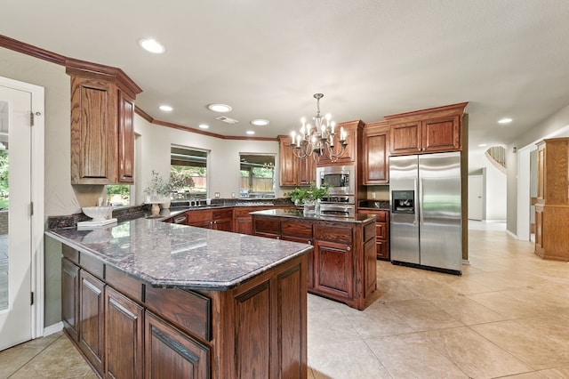 1610 Ottinger Rd, Keller, TX 76262 - kitchen featuring stainless steel appliances, a peninsula, a chandelier, dark stone countertops, and a center island