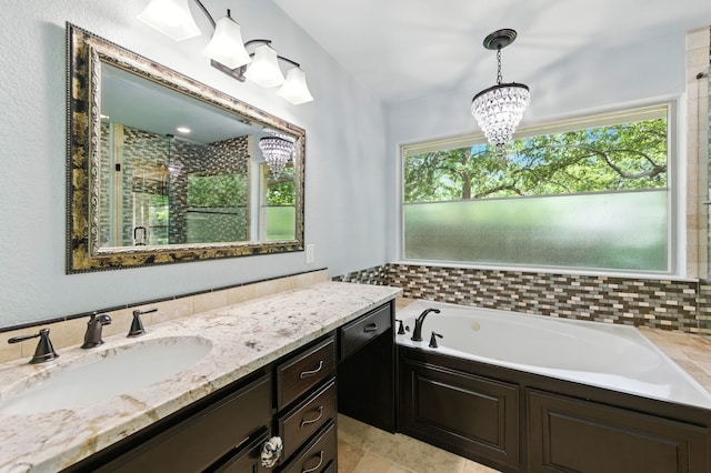 1610 Ottinger Rd, Keller, TX 76262 - full bathroom with healthy amount of natural light, vanity, a garden tub, and a chandelier