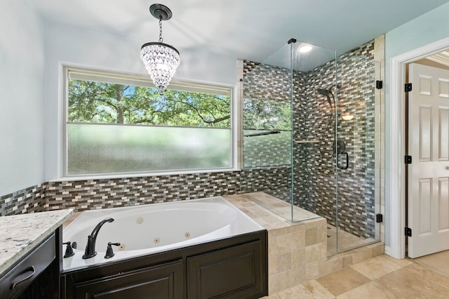 1610 Ottinger Rd, Keller, TX 76262 - full bathroom with a jetted tub, a stall shower, a chandelier, tile patterned flooring, and vanity
