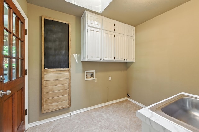 1610 Ottinger Rd, Keller, TX 76262 - laundry area with cabinet space, washer hookup, and light tile patterned flooring