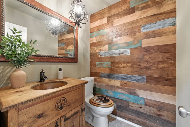 1610 Ottinger Rd, Keller, TX 76262 - bathroom featuring wooden walls, vanity, and a chandelier