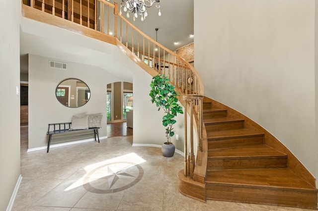 1610 Ottinger Rd, Keller, TX 76262 - stairs with arched walkways, a towering ceiling, and a chandelier
