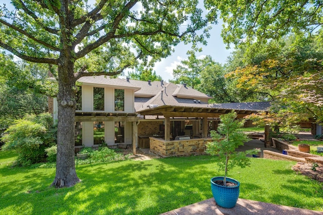 1610 Ottinger Rd, Keller, TX 76262 - rear view of house featuring a lawn, an outdoor kitchen, a pergola, and a shingled roof