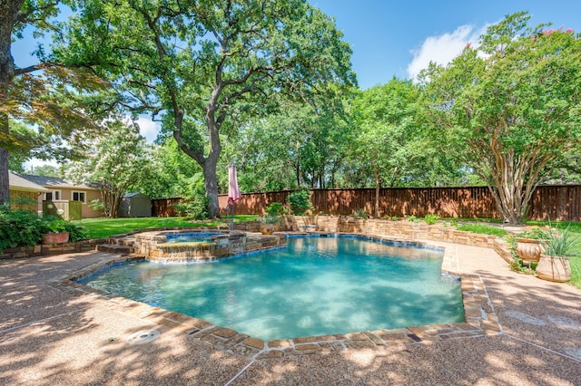 1610 Ottinger Rd, Keller, TX 76262 - view of swimming pool featuring a storage unit, a fenced backyard, a patio area, and a pool with connected hot tub