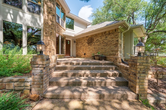 1610 Ottinger Rd, Keller, TX 76262 - view of exterior entry with brick siding and roof with shingles
