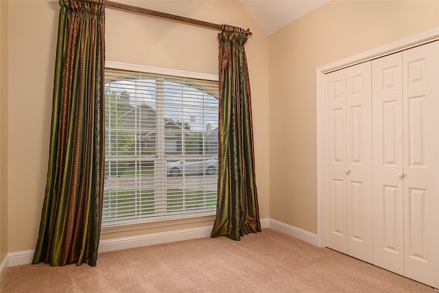 108 Arbor Ln, Shreveport, LA 71115 - unfurnished bedroom featuring carpet, lofted ceiling, a closet, and baseboards