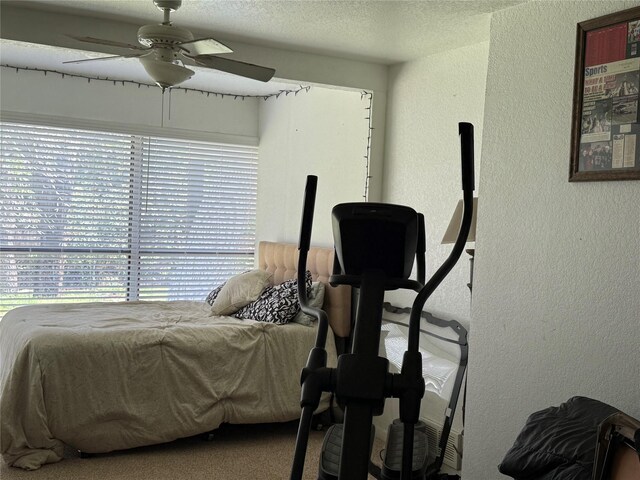 4 Preston Pl, Mineral Wells, TX 76067 - bedroom with a textured wall, a ceiling fan, and a textured ceiling