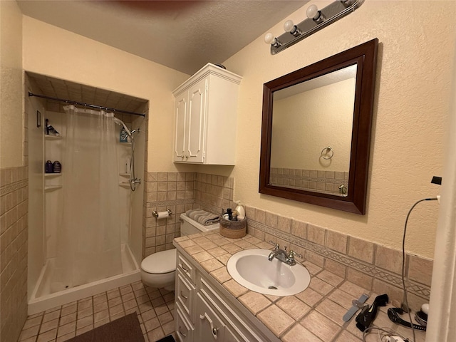 4 Preston Pl, Mineral Wells, TX 76067 - full bath featuring tile walls, tile patterned floors, a shower with shower curtain, vanity, and wainscoting