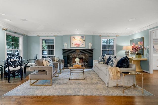 4561 Bordeaux Ave, Highland Park, TX 75205 - living area with healthy amount of natural light, wood finished floors, ornamental molding, and a fireplace