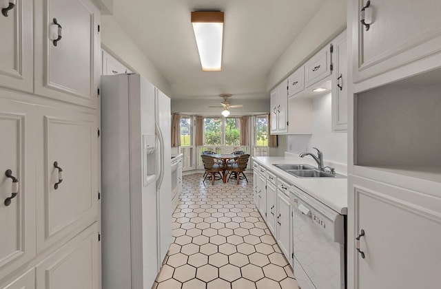 2832 Wooded Acres Dr, Waco, TX 76710 - kitchen with white appliances, a sink, light countertops, and white cabinetry