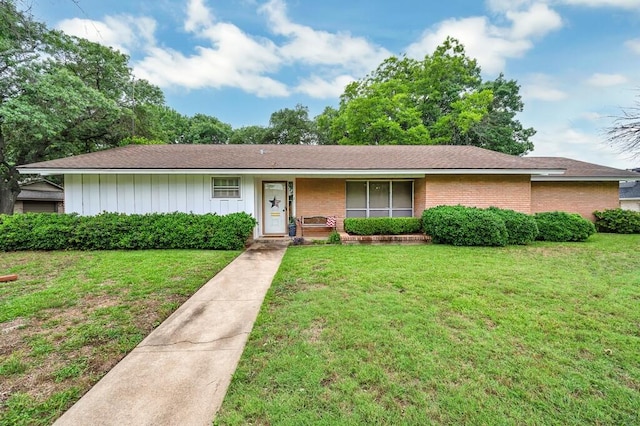 2832 Wooded Acres Dr, Waco, TX 76710 - ranch-style home featuring a front lawn, brick siding, and a shingled roof