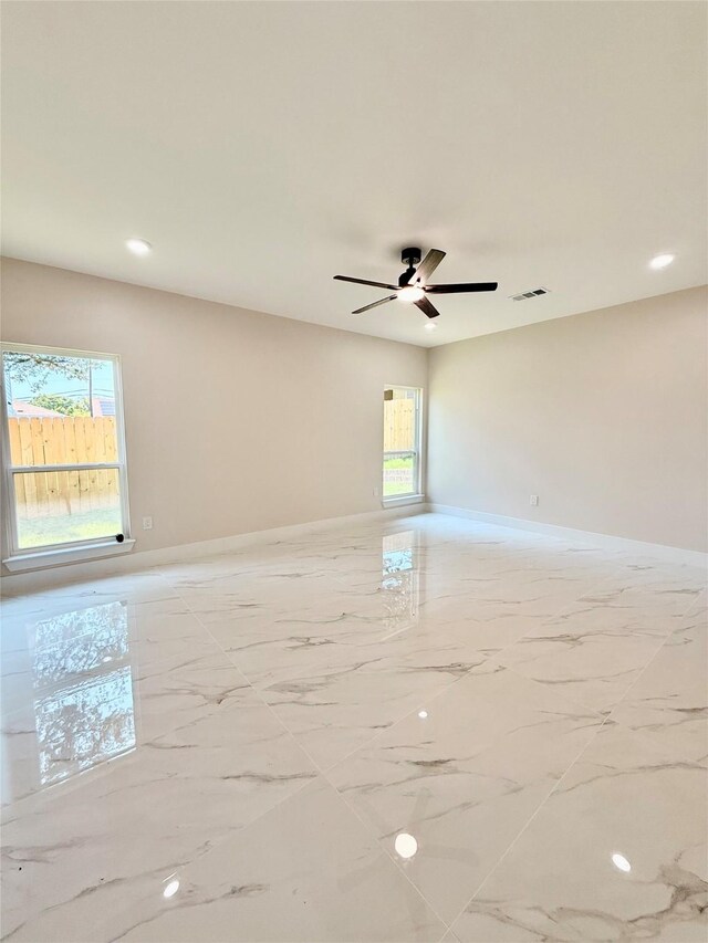 2815 Pall Mall Ave, Dallas, TX 75241 - full bath featuring toilet, vanity, a stall shower, marble look tile flooring, and baseboards