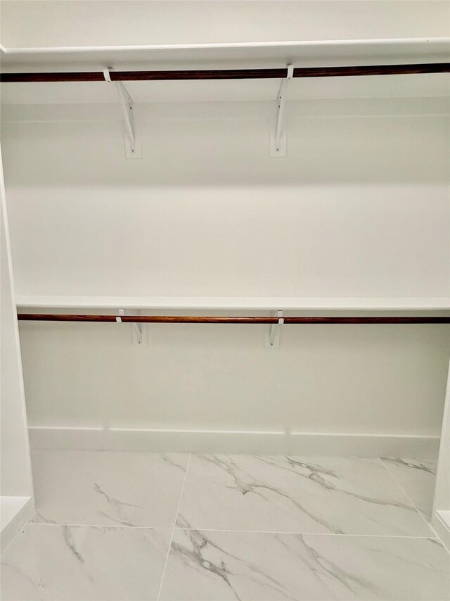 2815 Pall Mall Ave, Dallas, TX 75241 - washroom with hookup for an electric dryer, washer hookup, baseboards, and light marble finish floors