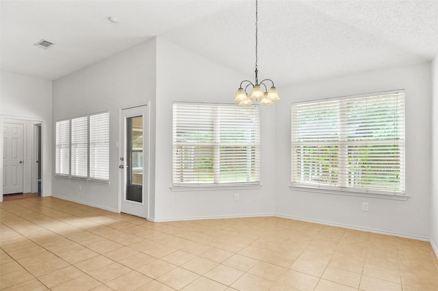 7536 Meadow Creek Dr, Fort Worth, TX 76123 - empty room featuring plenty of natural light, a chandelier, light tile patterned floors, baseboards, and vaulted ceiling