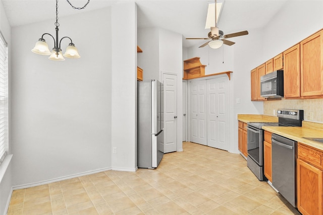 7536 Meadow Creek Dr, Fort Worth, TX 76123 - kitchen with appliances with stainless steel finishes, a chandelier, ceiling fan, decorative backsplash, and light countertops