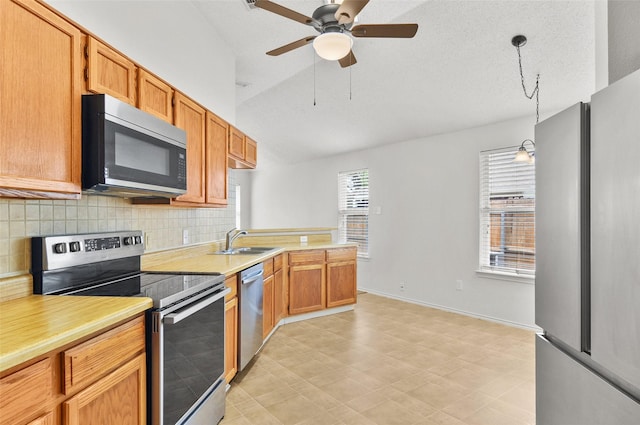 7536 Meadow Creek Dr, Fort Worth, TX 76123 - kitchen with stainless steel appliances, a sink, vaulted ceiling, light countertops, and decorative backsplash
