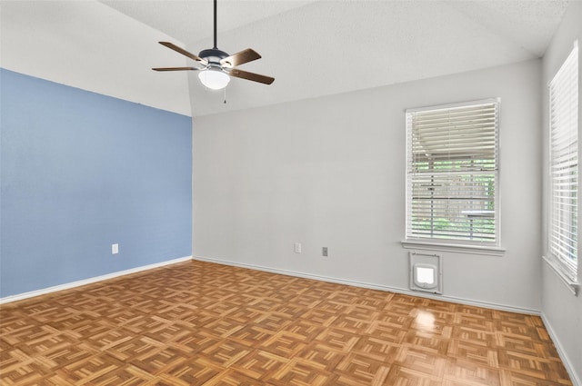7536 Meadow Creek Dr, Fort Worth, TX 76123 - empty room with a ceiling fan, lofted ceiling, baseboards, and a textured ceiling