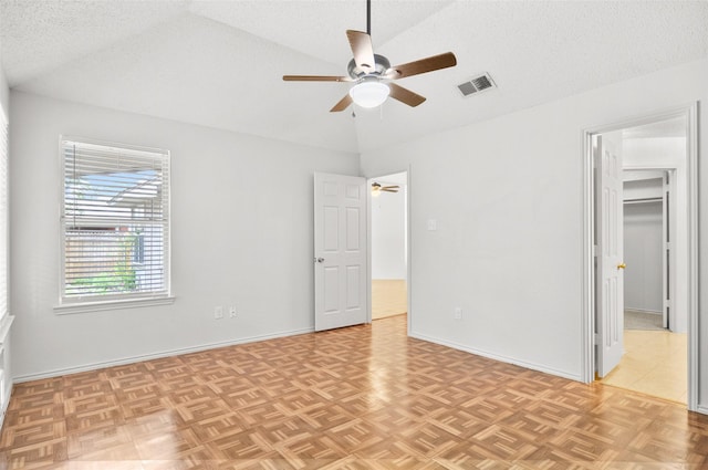 7536 Meadow Creek Dr, Fort Worth, TX 76123 - unfurnished bedroom featuring lofted ceiling, a textured ceiling, a walk in closet, baseboards, and ceiling fan
