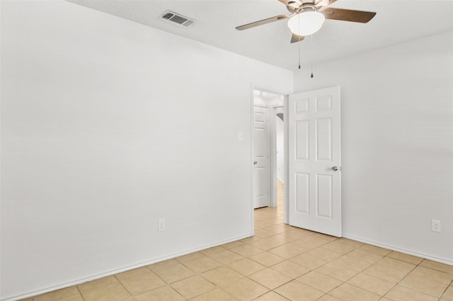 7536 Meadow Creek Dr, Fort Worth, TX 76123 - empty room featuring a ceiling fan, light tile patterned floors, and baseboards