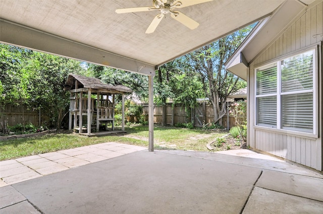 7536 Meadow Creek Dr, Fort Worth, TX 76123 - fenced backyard featuring a ceiling fan and a patio area