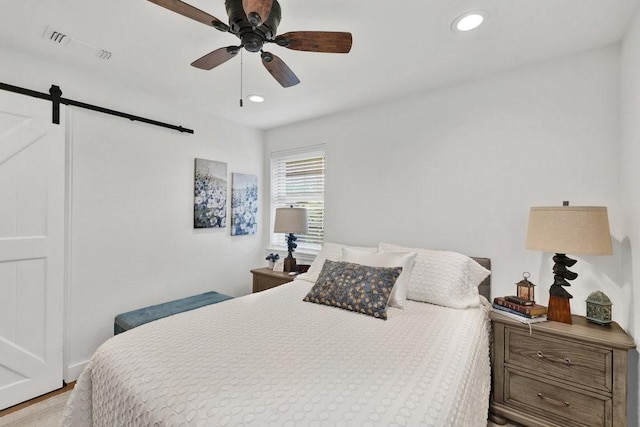 208 E 7th St, Prosper, TX 75078 - bedroom with a barn door, recessed lighting, and ceiling fan