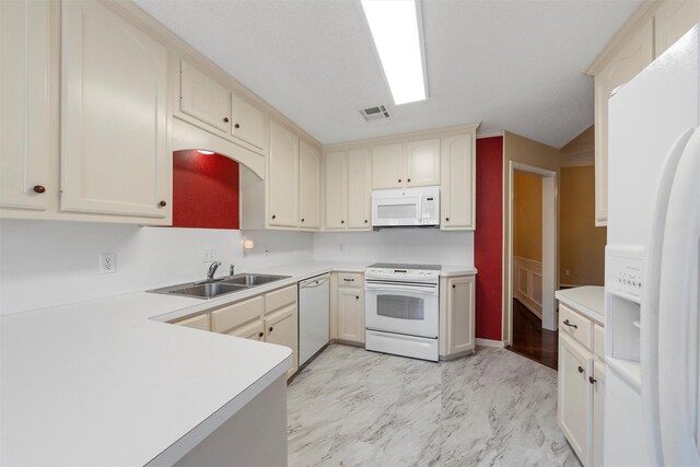 2008 Real Dr, Waco, TX 76712 - kitchen featuring white appliances, a sink, light countertops, and light marble finish flooring