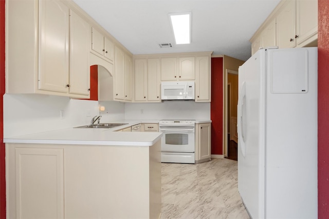 2008 Real Dr, Waco, TX 76712 - kitchen featuring white appliances, a peninsula, a sink, light countertops, and light marble finish floors