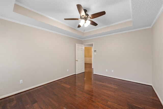 2008 Real Dr, Waco, TX 76712 - unfurnished room with a raised ceiling, wood finished floors, ceiling fan, ornamental molding, and baseboards