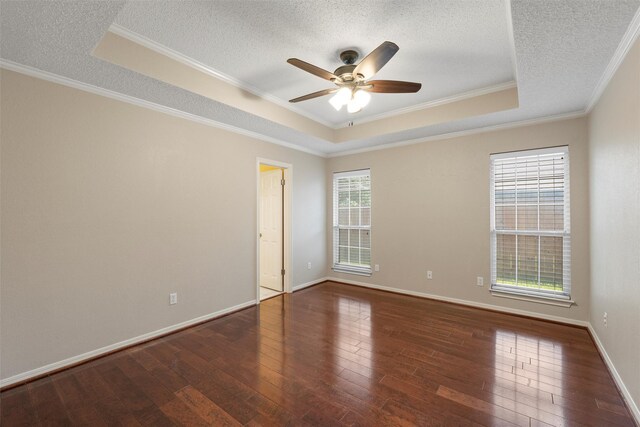 2008 Real Dr, Waco, TX 76712 - unfurnished room featuring a raised ceiling, hardwood / wood-style flooring, ornamental molding, ceiling fan, and a textured ceiling