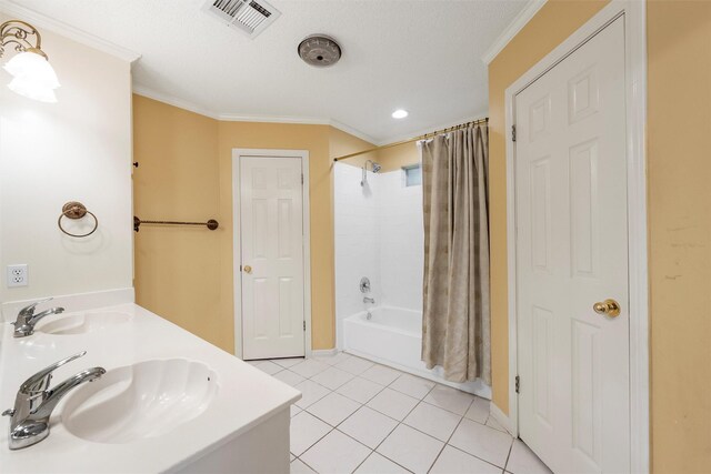 2008 Real Dr, Waco, TX 76712 - full bathroom with crown molding, shower / tub combo with curtain, tile patterned flooring, double vanity, and baseboards