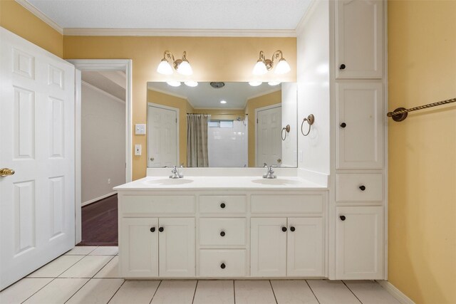 2008 Real Dr, Waco, TX 76712 - full bathroom with crown molding, tile patterned floors, double vanity, baseboards, and curtained shower