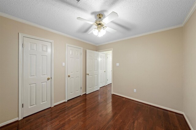 2008 Real Dr, Waco, TX 76712 - unfurnished bedroom featuring a textured ceiling, wood finished floors, ornamental molding, baseboards, and a ceiling fan