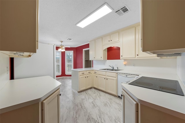 2008 Real Dr, Waco, TX 76712 - kitchen with a sink, white appliances, a peninsula, light countertops, and a textured ceiling