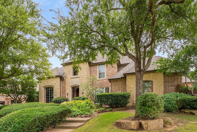 2830 Creekwood Ln, Prosper, TX 75078 - view of front of home with stone siding and a shingled roof