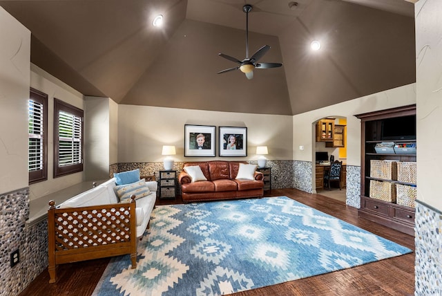 2830 Creekwood Ln, Prosper, TX 75078 - living room with a wainscoted wall, ceiling fan, wood finished floors, arched walkways, and high vaulted ceiling