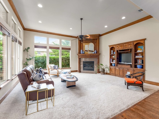2830 Creekwood Ln, Prosper, TX 75078 - living area featuring crown molding, a ceiling fan, baseboards, a fireplace, and recessed lighting
