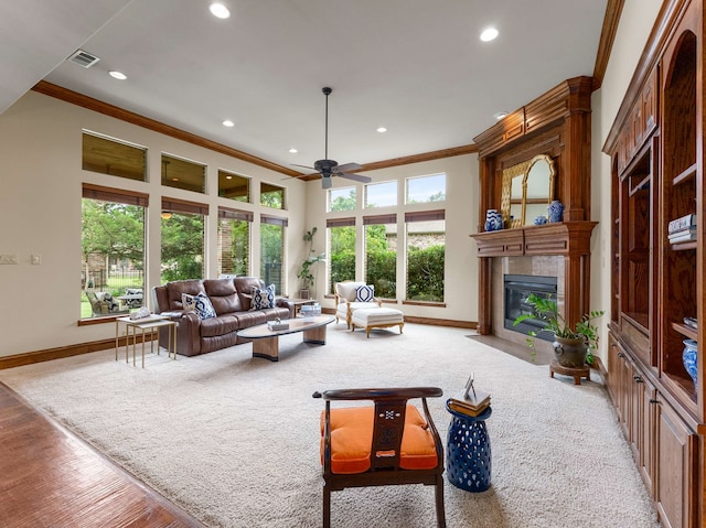 2830 Creekwood Ln, Prosper, TX 75078 - living area featuring ornamental molding, baseboards, a fireplace, recessed lighting, and ceiling fan