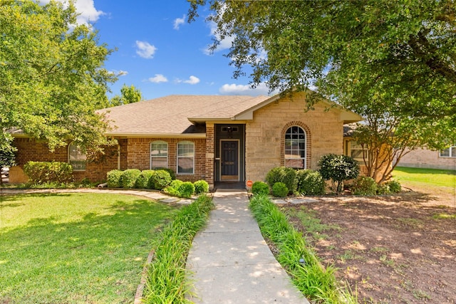 509 Sapphire Blvd, Hewitt, TX 76643 - ranch-style house with a front yard, a shingled roof, and brick siding