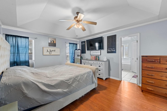 509 Sapphire Blvd, Hewitt, TX 76643 - bedroom with a raised ceiling, light wood-type flooring, ornamental molding, connected bathroom, and a ceiling fan